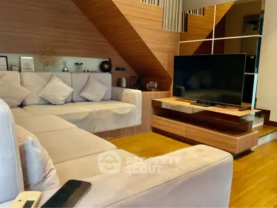 Modern living room with stylish wooden accents and cozy seating area