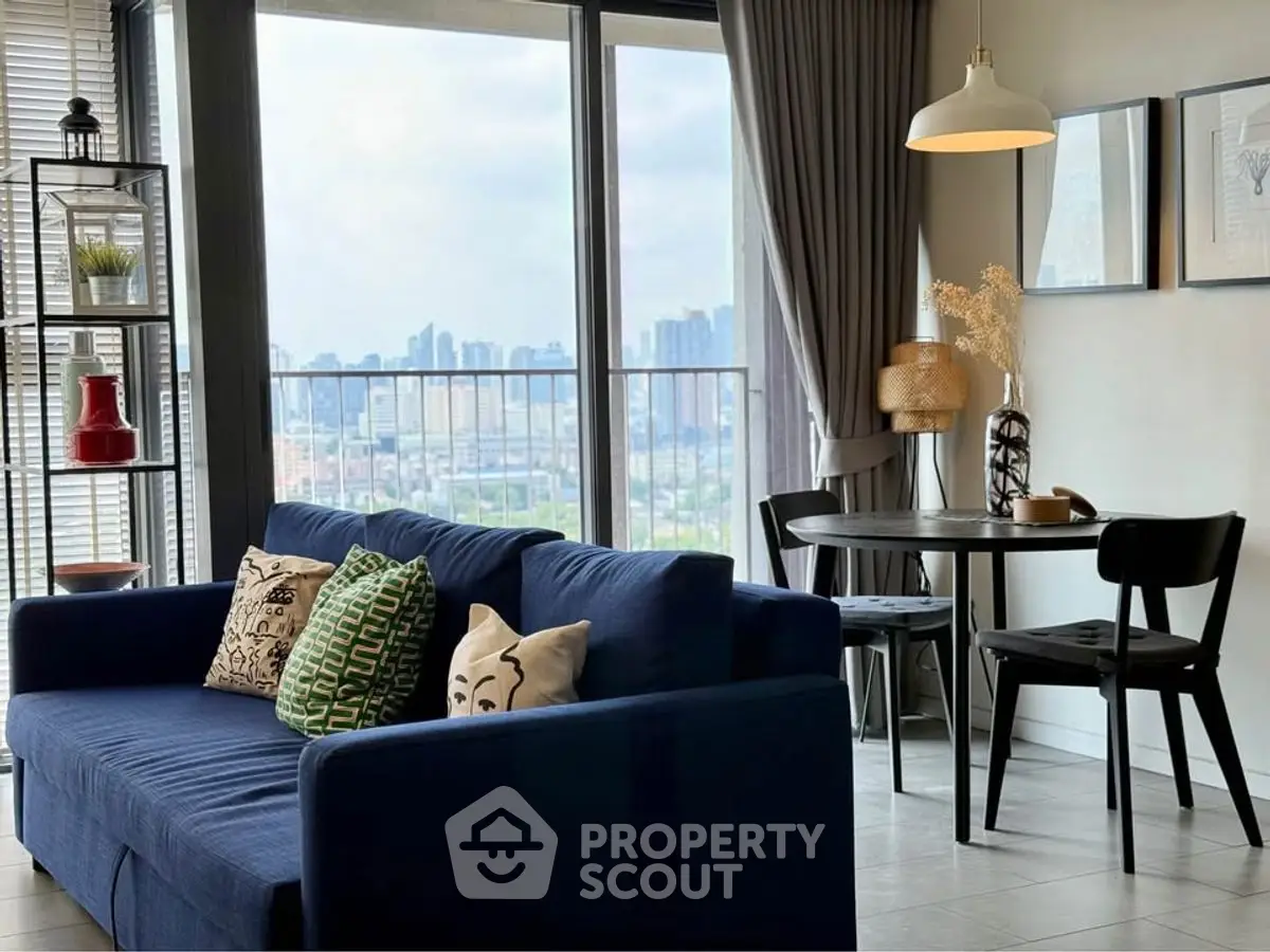 Stylish living room with city view, modern furniture, and cozy ambiance.