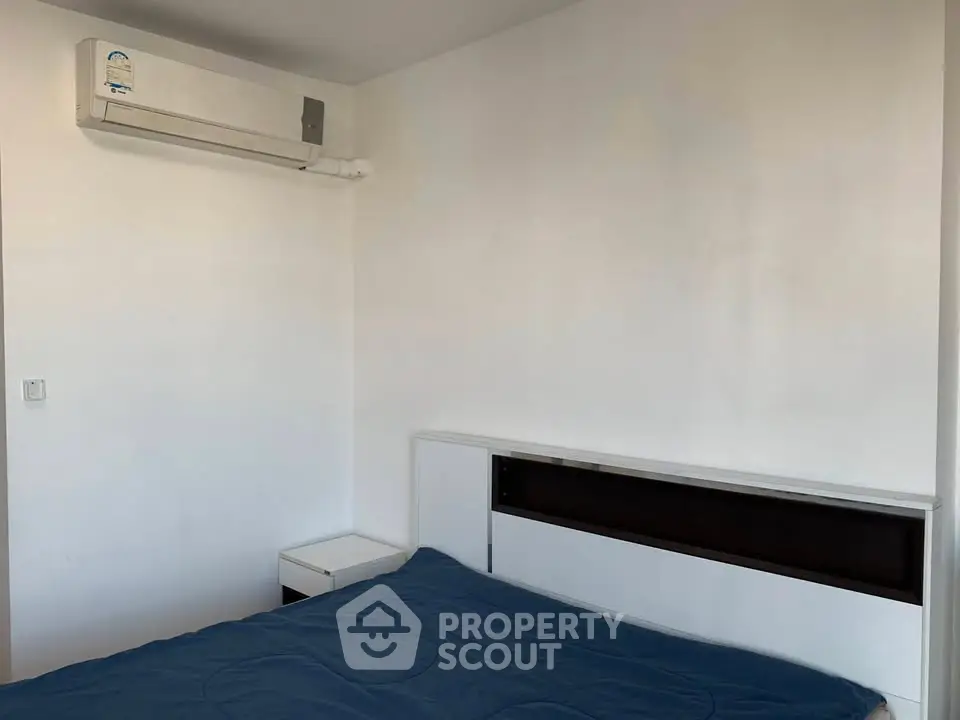 Minimalist bedroom with air conditioning and modern bed design