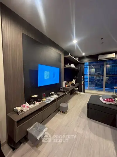 Modern living room with sleek entertainment center and cozy seating area