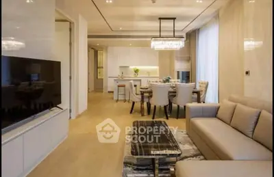 Luxurious open-plan living room with elegant dining area and modern decor
