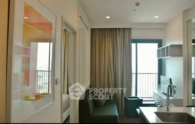 Modern apartment interior with open layout and balcony view.