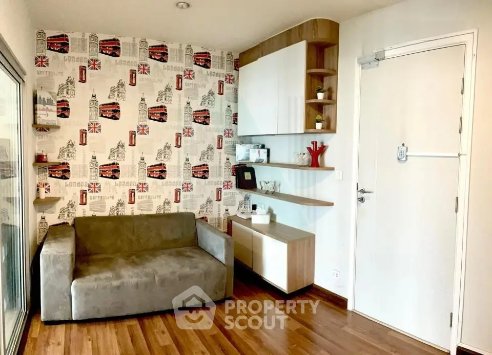 Charming living room with stylish wallpaper and modern shelving, perfect for cozy relaxation.