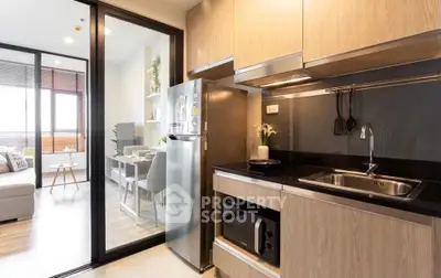 Modern kitchen with sleek appliances and open layout in stylish apartment