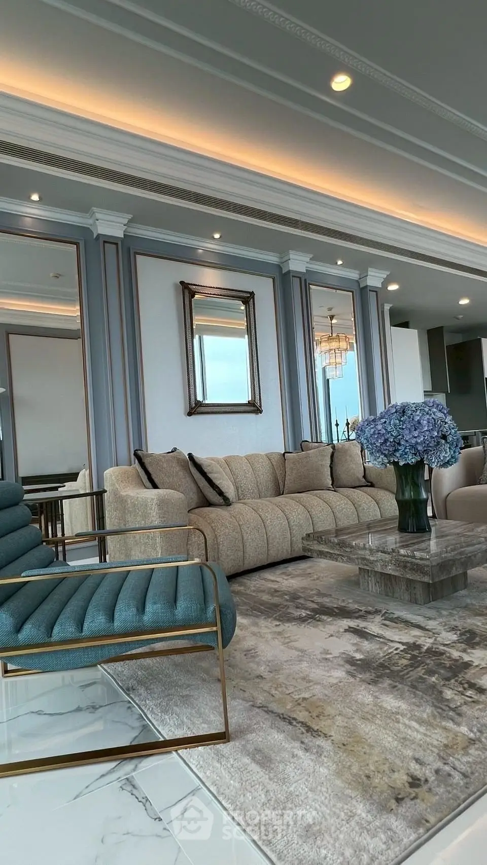 Luxurious living room with elegant decor and stunning view, featuring plush seating and modern design elements.