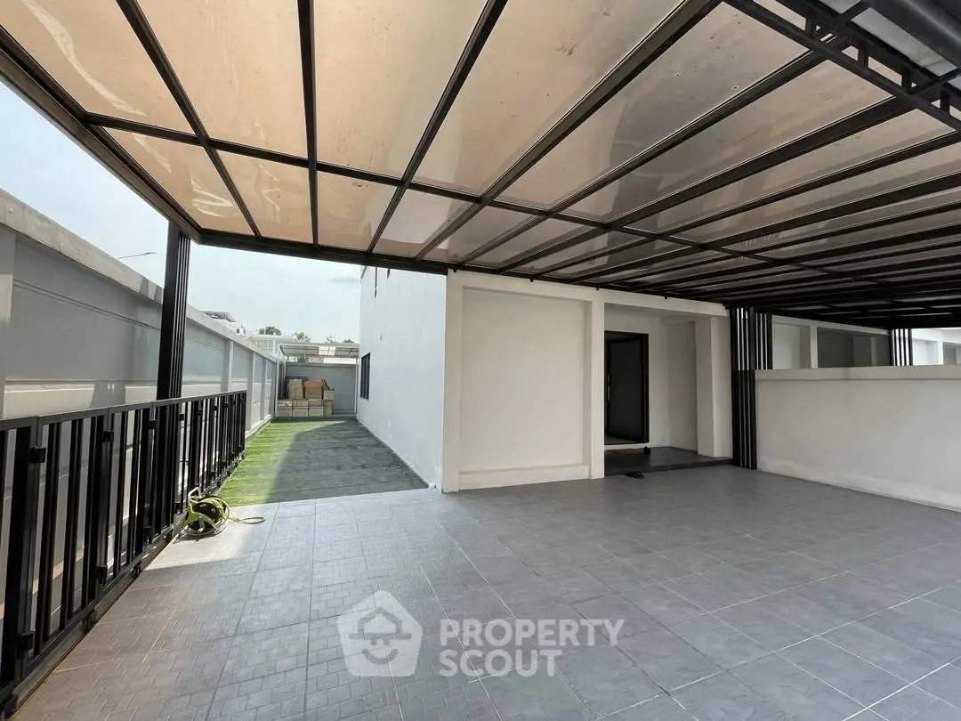 Spacious modern carport with sleek design and ample natural light, perfect for urban living.
