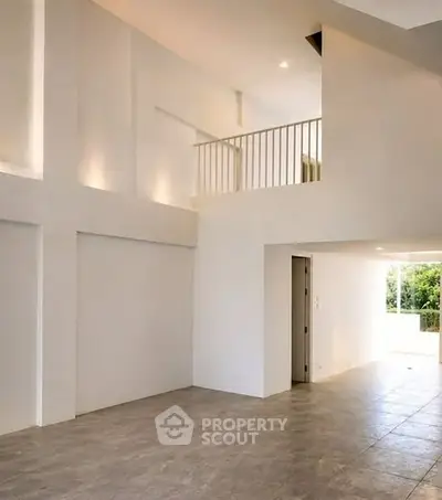 Spacious modern interior with high ceilings and natural light