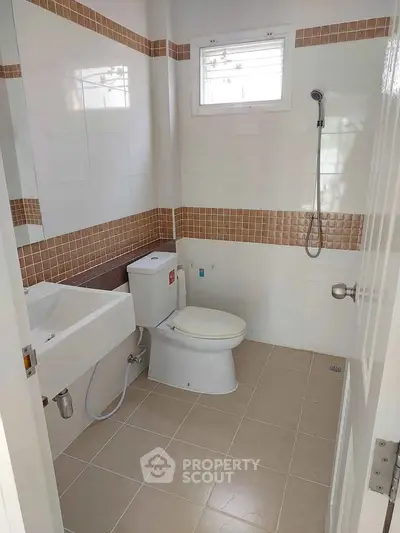Modern bathroom with sleek fixtures and neutral tile design