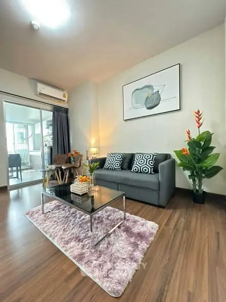 Stylish living room with modern decor and cozy ambiance in a contemporary apartment.