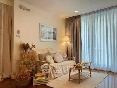 Cozy living room with elegant decor and natural light, featuring a comfortable sofa and stylish coffee table.