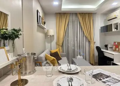 Modern living room with elegant decor and cozy workspace