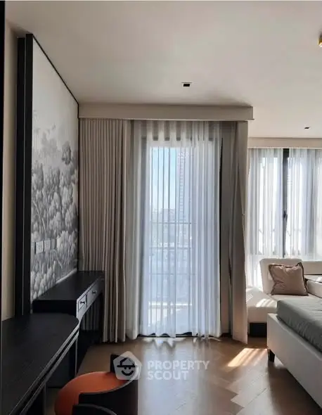 Elegant modern living room with floor-to-ceiling windows and stylish decor