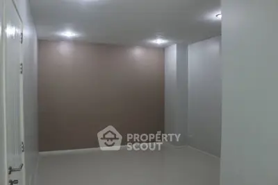 Minimalist empty room with modern lighting and neutral walls, perfect for customization.