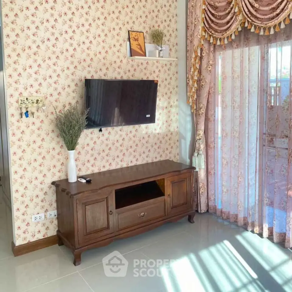 Charming living room with floral wallpaper and elegant curtains