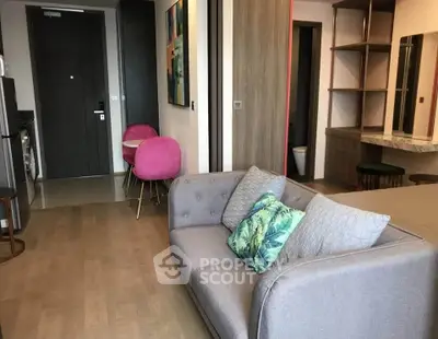 Modern living room with stylish decor and cozy seating in a contemporary apartment.