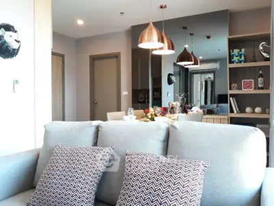 Modern living room with stylish decor and cozy seating in a contemporary apartment.