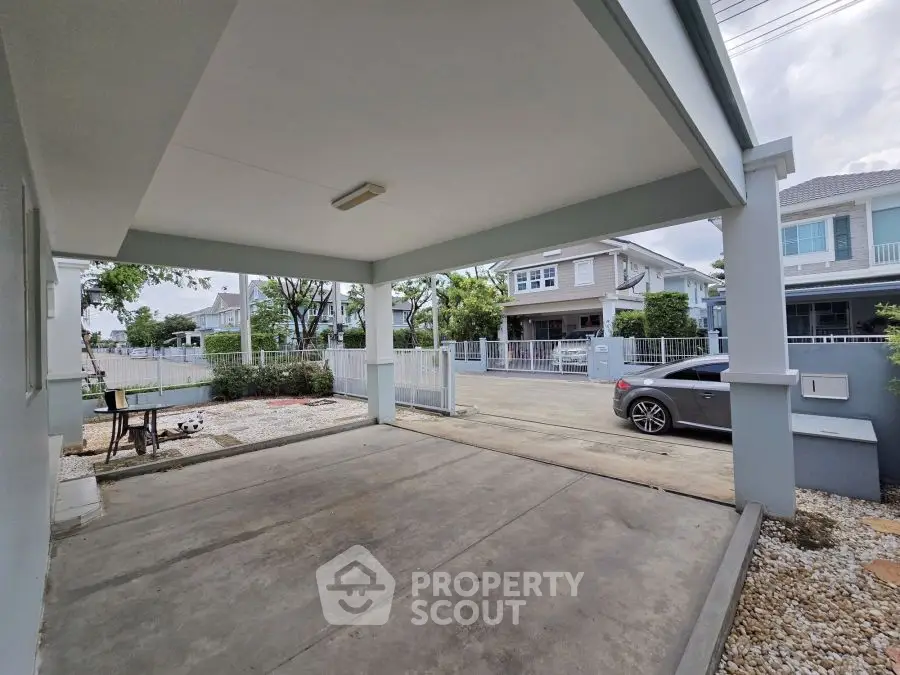 Spacious covered parking area in modern residential neighborhood