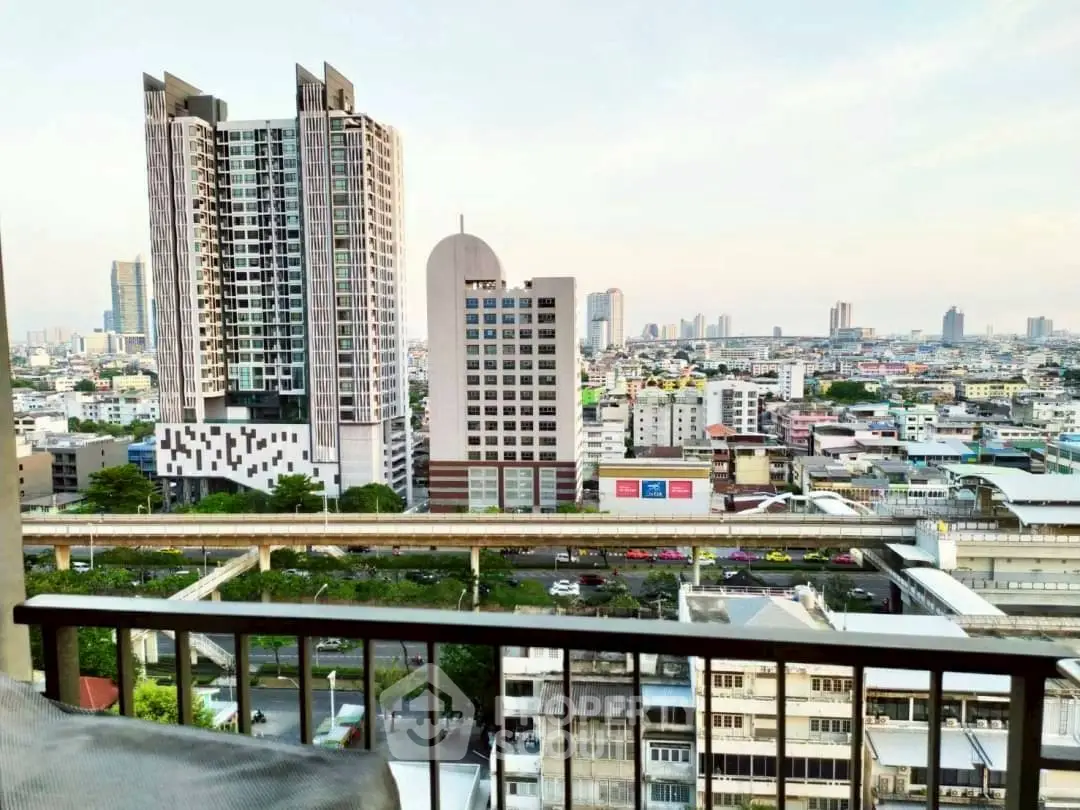 Stunning cityscape view from a high-rise balcony overlooking urban skyline and modern architecture.