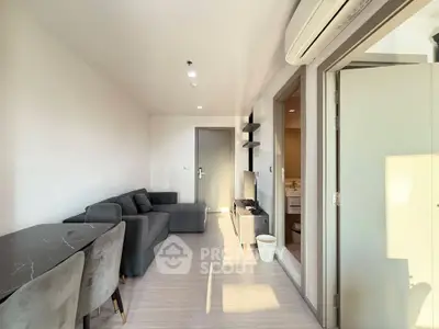 Modern living room with sleek furniture and natural light, perfect for urban living.
