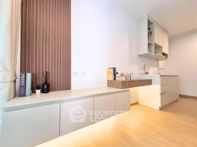 Modern minimalist living room with sleek cabinetry and ambient lighting