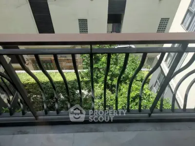 Charming balcony view with lush greenery and modern railing design