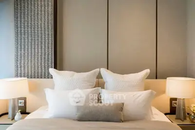 Luxurious bedroom with elegant decor and plush pillows, perfect for relaxation and comfort.