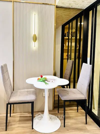 Chic modern dining area with elegant chairs and round table, perfect for cozy meals in a stylish setting.
