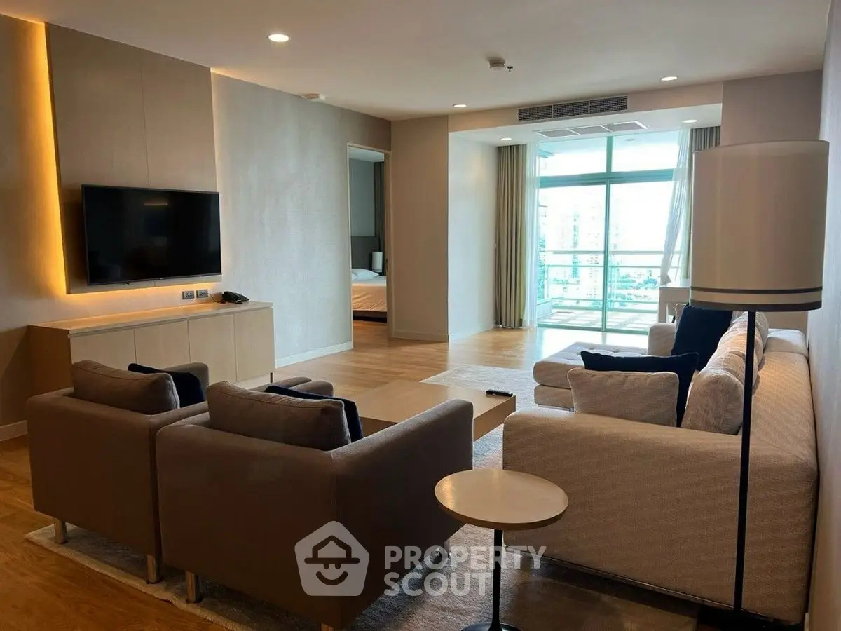 Spacious modern living room with natural light and elegant furnishings