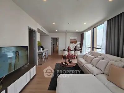 Spacious modern living room with large windows and stylish decor