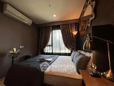 Luxurious bedroom with elegant decor and ambient lighting, featuring a plush bed and stylish furnishings.