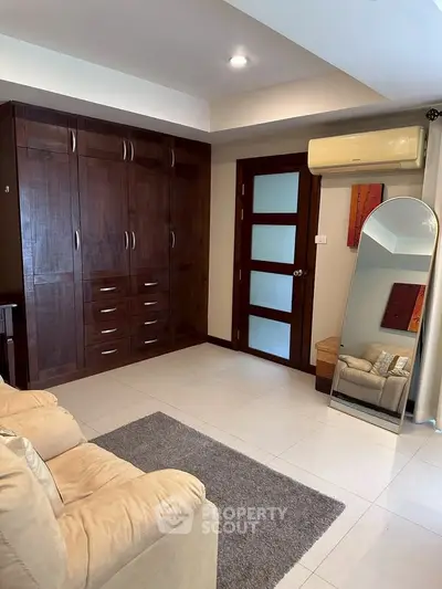 Cozy living room with built-in wardrobe and modern decor
