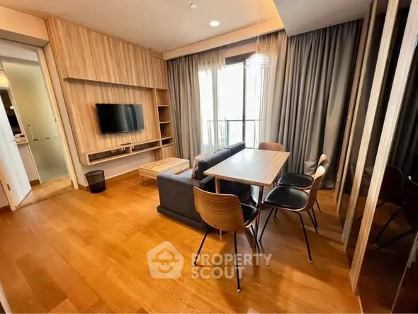 Modern living room with wooden flooring and stylish furniture