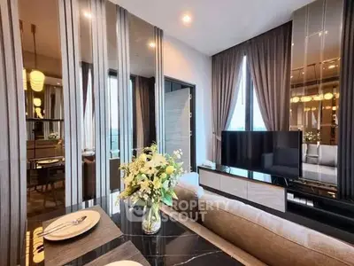 Luxurious modern living room with elegant decor and large windows offering natural light.