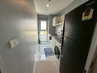Modern kitchen with sleek appliances and bright natural light