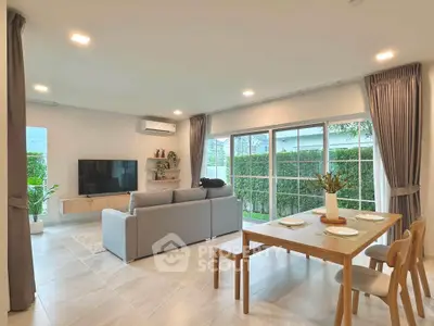 Spacious modern living room with large windows and stylish furniture