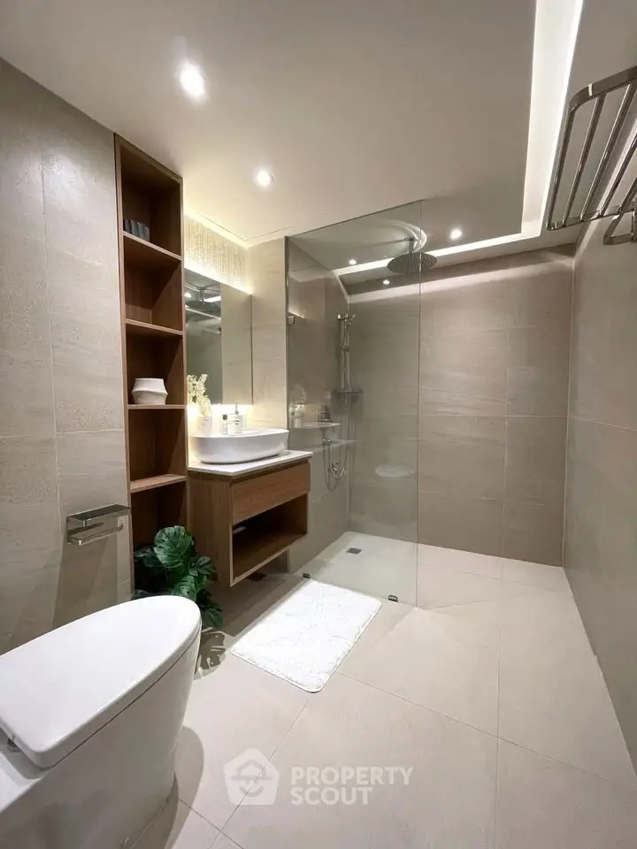 Modern bathroom with sleek design and glass shower enclosure