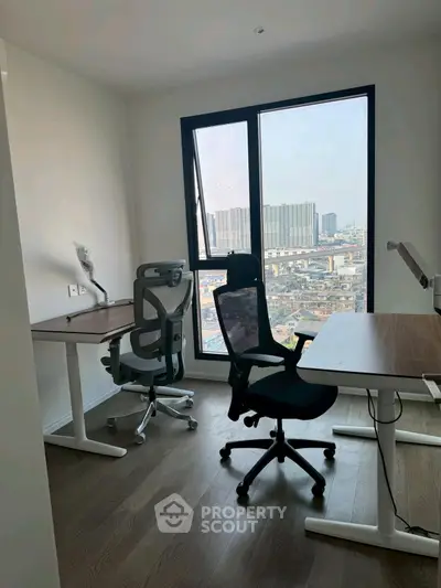 Modern study room with ergonomic chairs and city view from window