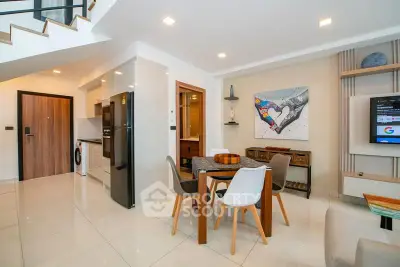 Modern open-plan living area with stylish dining set and contemporary decor