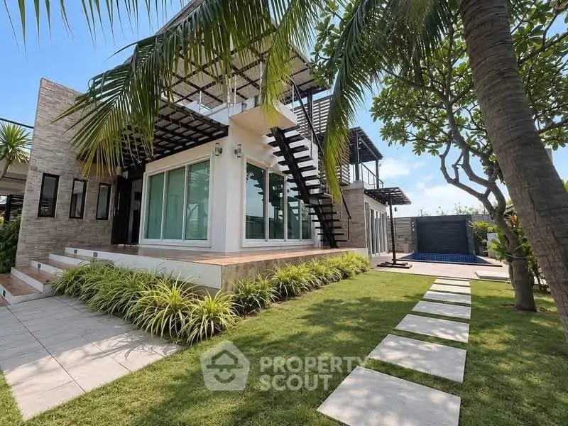 Modern luxury villa with lush garden and sleek architecture, featuring large windows and outdoor staircase.