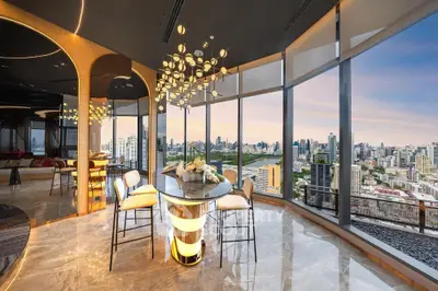 Luxurious high-rise apartment with panoramic city views and elegant interior design.