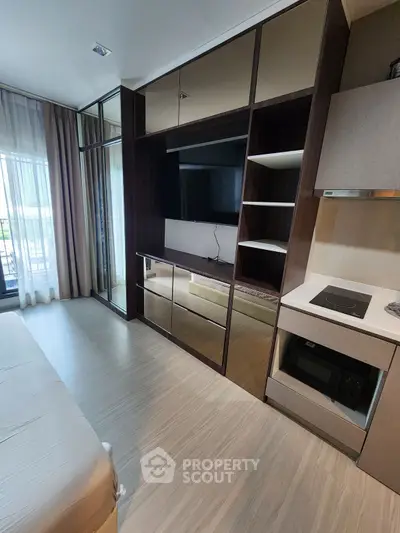 Modern bedroom with built-in entertainment unit and sleek design