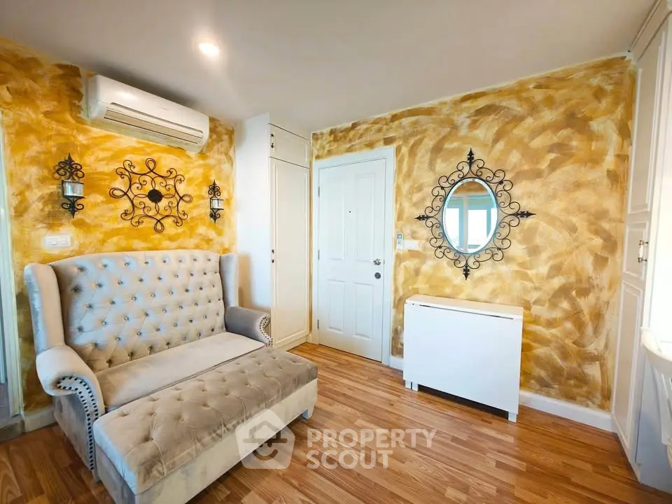 Charming living room with elegant tufted sofa and artistic wall decor