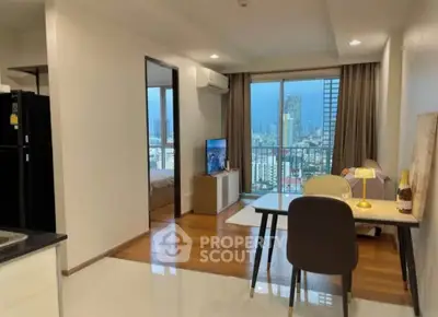 Modern apartment with open layout, city view, and stylish furnishings