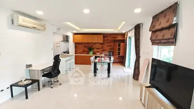 Spacious modern living room with open kitchen and stylish decor