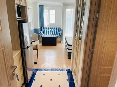 Charming studio apartment with modern kitchen and cozy living area, perfect for urban living.