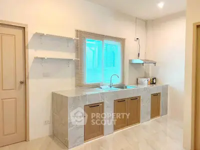 Modern kitchen with sleek cabinetry and open layout design