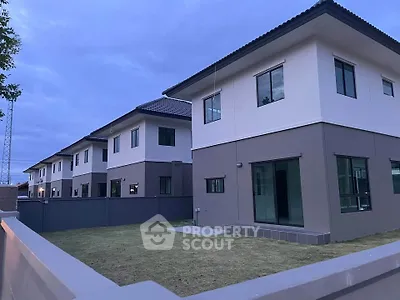 Modern two-story homes with spacious yards in a serene neighborhood setting.