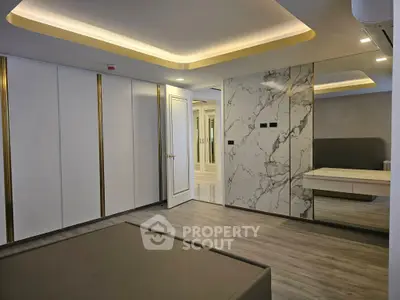 Luxurious modern bedroom with marble accents and sleek design