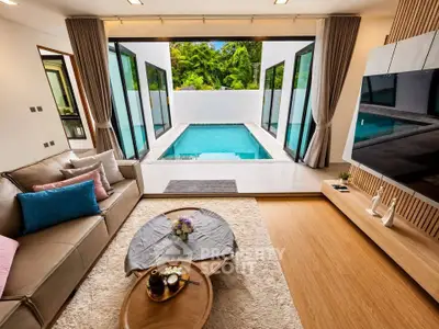 Luxurious living room with pool view, modern decor, and spacious layout in a high-end property.
