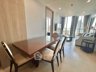 Modern living room with dining area and city view in high-rise apartment